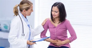 Woman experiencing abdominal pain and bloating , possible IBS or IBD symptoms
