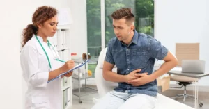 Gastroenterologist consulting a patient about persistent acid reflux and potential Gastroesophageal Reflux Disease (GERD) diagnosis