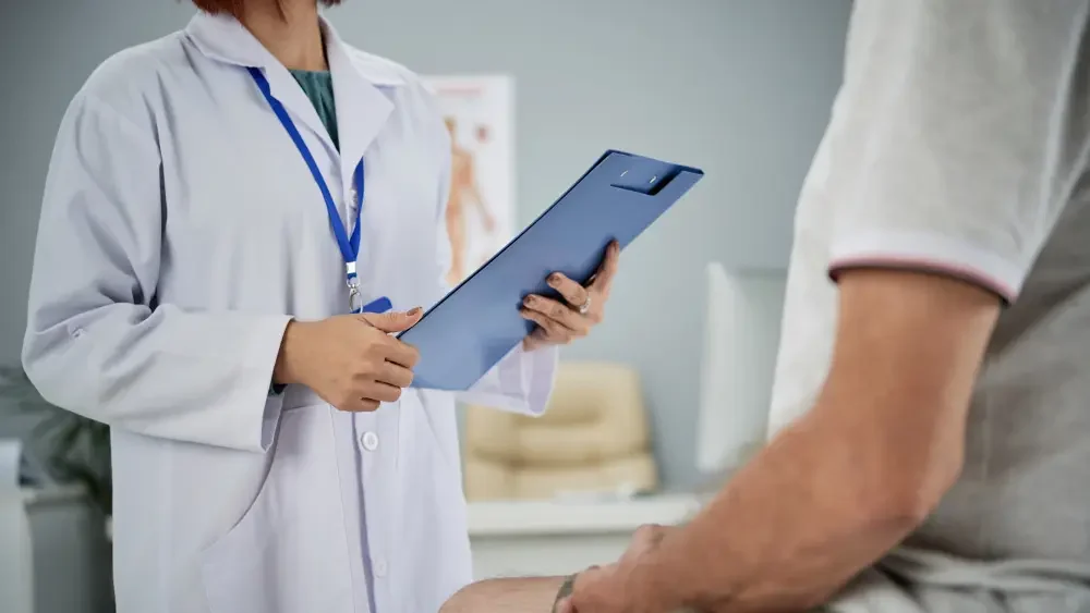 GI specialist consulting patient for ulcer treatment in Chicago